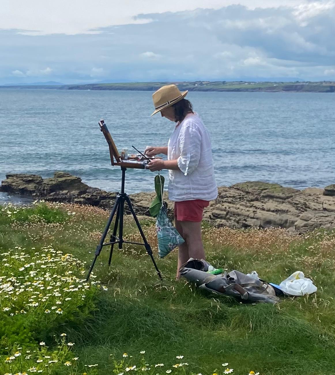 Marie Kelly painting en plein air at Hook Lighthouse, Wexford