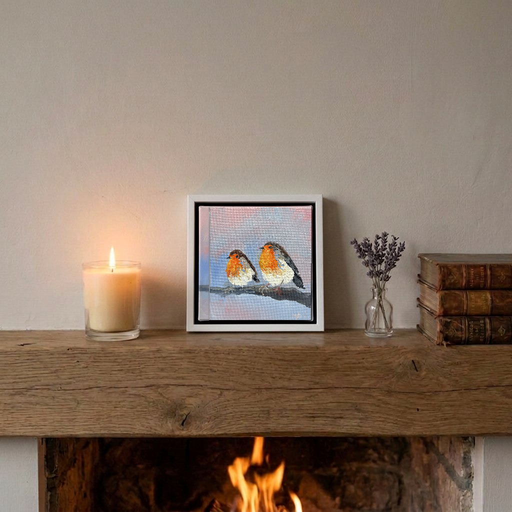 In situ — sitting on a mantelpiece, shown in a slim white frame, approximately 15 × 15 cm framed